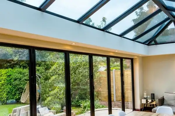 Glass roof system above a garden-facing living space