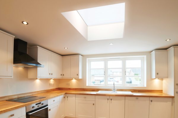 Flat skylight above a bright shaker kitchen