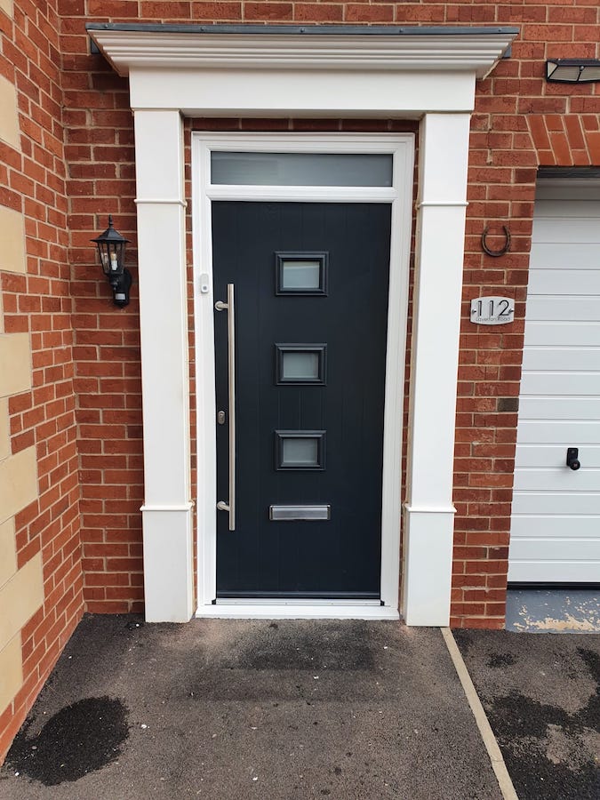 Anthracite composite front door on an Island home