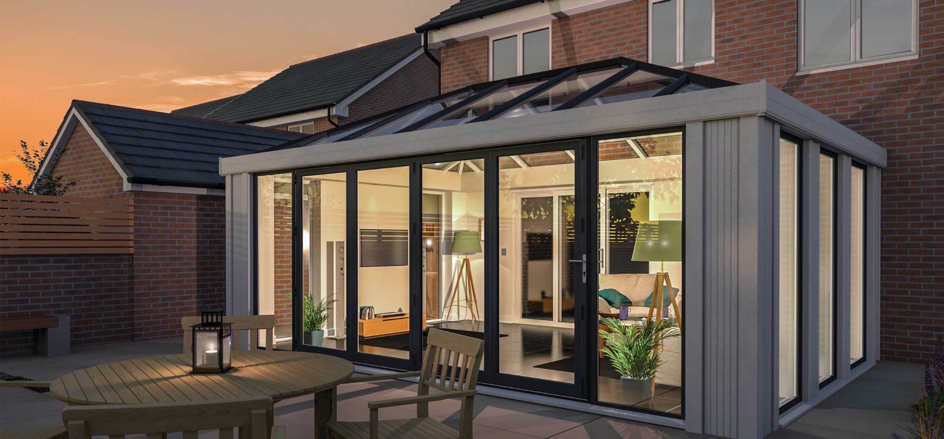 Contemporary orangery with lantern roof at dusk