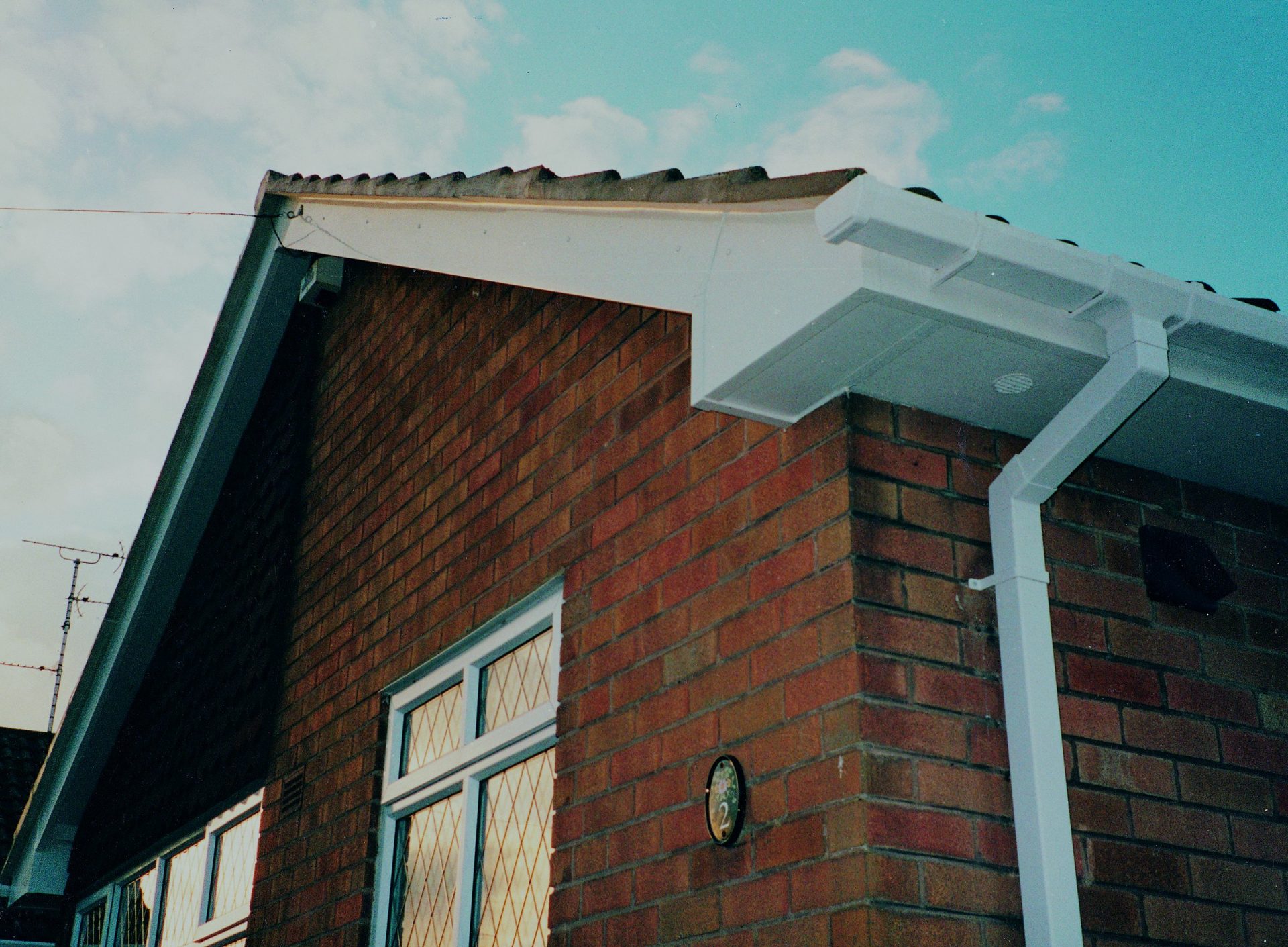 Classic white uPVC fascias, bargeboards and guttering on a traditional British brick property